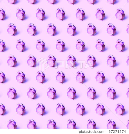 Creative layout of purple alarm clock's on neon purple background. Minimal concept. 67271274