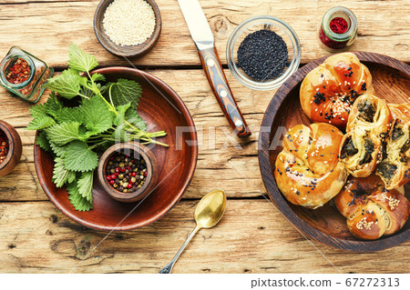 Appetizing bun with nettles. 67272313