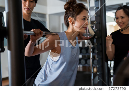 Young woman, muscle training, gym Young woman, muscle training, gym 67272790