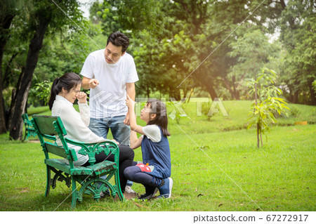 Unhappy,problems asian family,husband pointing at wife blaming her quarreling,parents quarrel,arguing child girl listen,mother,daughter crying,aggressive father,family conflict,violence in outdoor Unhappy,problems asian family,husband pointing at wife blaming her quarreling,parents quarrel,arguing child girl listen,mother,daughter crying,aggressive father,family conflict,violence in outdoor 67272917