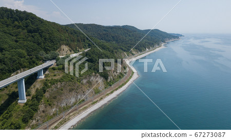 Aerial view of high bridge and mountain road with cars and truck, Black Sea, Russia Aerial view of high bridge and mountain road with cars and truck, Black Sea, Russia 67273087