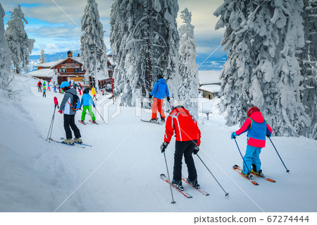 Popular ski resort with skiers on the slope, Poiana Brasov Popular ski resort with skiers on the slope, Poiana Brasov 67274444
