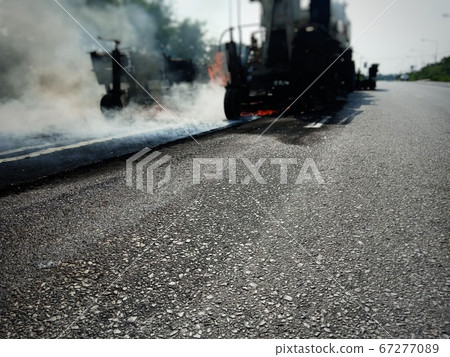 Road maintenance work with the ASPHALT HOT MIX IN Road maintenance work with the ASPHALT HOT MIX IN 67277089