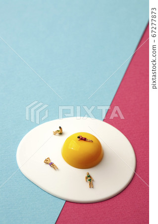 Miniature men and women on sunny side up eggs Miniature men and women on sunny side up eggs 67277873