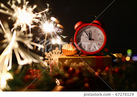 New Years celebration sparklers at midnight New Years celebration sparklers at midnight 67278129