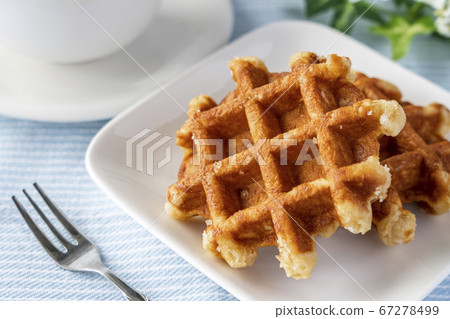 Waffles and cafe latte prepared for tea time 67278499