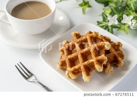 Waffles and cafe latte prepared for tea time [white background] 67278511