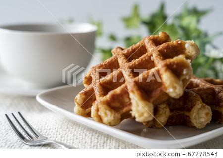 Waffles and cafe latte prepared for tea time 67278543