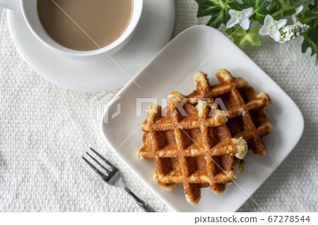 Waffles and cafe latte prepared for tea time [Overview] 67278544