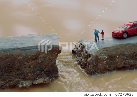 Breakdown of the levee due to heavy rain and diorama of people calling for help 67279623