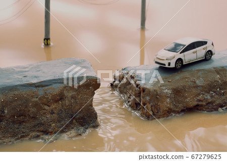 Breakdown of the levee due to heavy rain and diorama of people calling for help 67279625