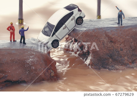 Breakdown of the levee due to heavy rain and diorama of people calling for help 67279629