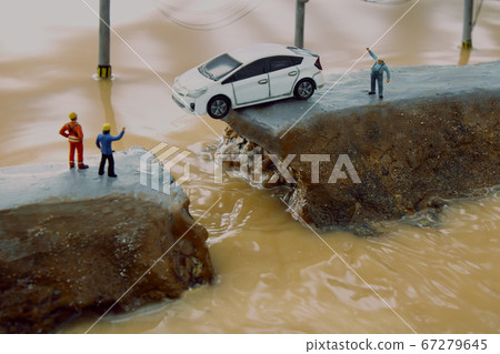 Breakdown of the levee due to heavy rain and diorama of people calling for help Breakdown of the levee due to heavy rain and diorama of people calling for help 67279645