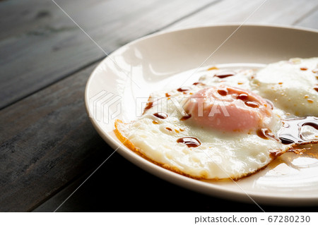 Fried egg over soy sauce Fried egg over soy sauce 67280230