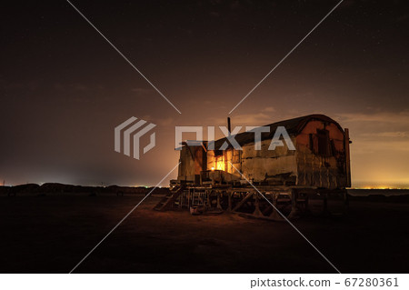 Old fishing hut in the night 67280361