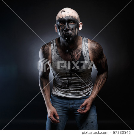 Image of bald mad man with black vomit in the mouth 67280545