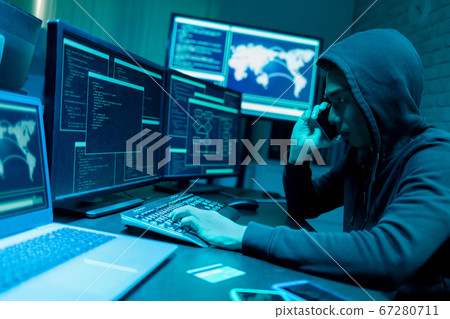 Asian male hacker use computer Asian male hacker use computer 67280711