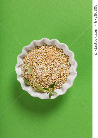 Quinoa in white bowls 67280806