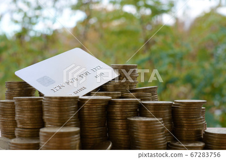 Credit card on big pile of shiny ukrainian old 1 67283756