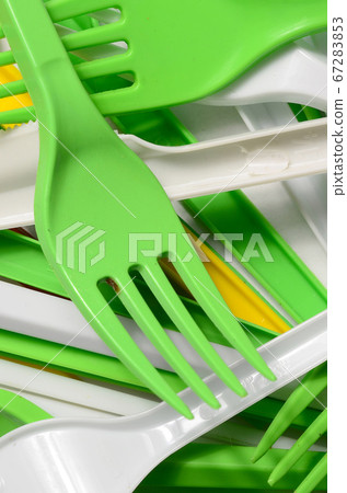 Pile of bright yellow, green and white used 67283853