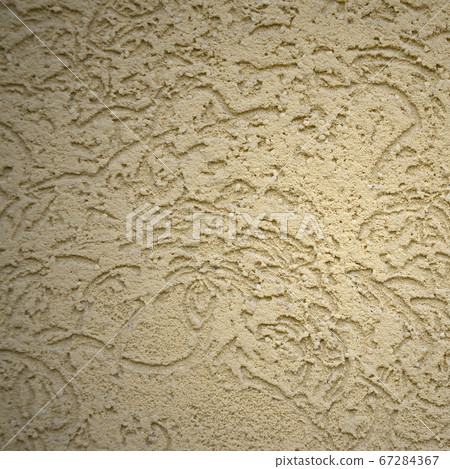 The texture of the beige decorative plaster in The texture of the beige decorative plaster in 67284367