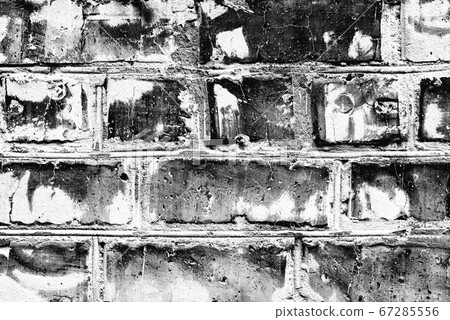 Texture of a brick wall with cracks and scratches 67285556