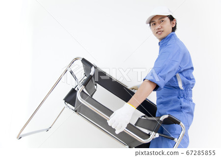 Moving company carrying chairs 67285855