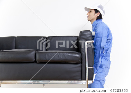 Moving company carrying chairs Moving company carrying chairs 67285863