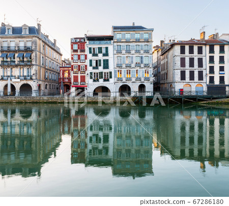 Old building facades reflecting in the Nive River in Bayonne, France Old building facades reflecting in the Nive River in Bayonne, France 67286180