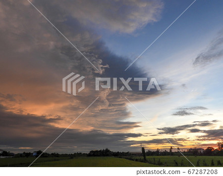 rain strom cloudy on the field 67287208