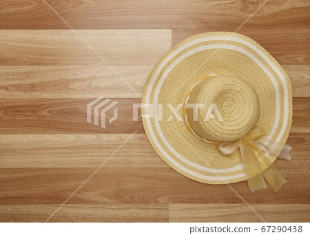 Overhead Straw hat on Work desk wooden Overhead Straw hat on Work desk wooden 67290438
