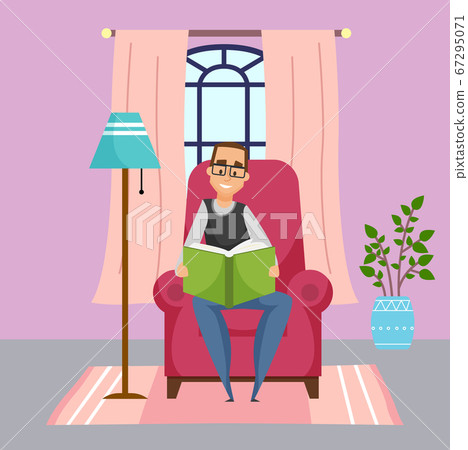 Adult man in glasses sitting at chair and reading book, leisure time during quarantine isolation 67295071