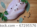 Chicken fillet, parsley, pepper, bay leaf on a 67295576