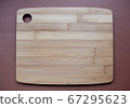 Wooden cutting Board on a brown background 67295623