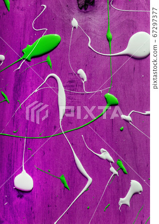Artist working wooden table top with paint marks spill all over the surface. Backgrounds collection 67297377