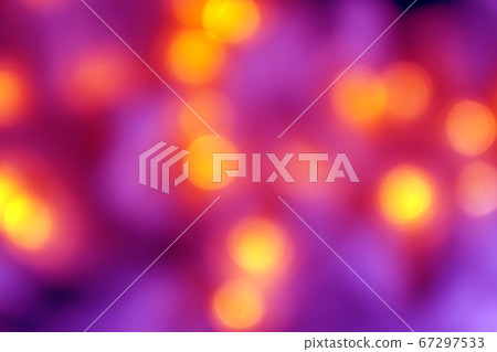 Background of blurry pink-purple-lilac lights of the Christmas-tree garland on the dark. Copy space 67297533