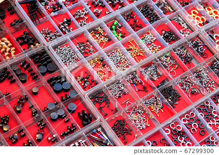 Earrings on the stall in street night market 67299300