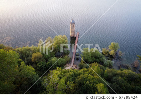 Aerial view of The fish cathedral. Sunken church ruins located in the Ebro reservoir in Cantabria 67299424