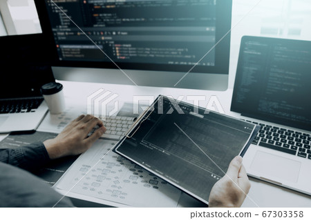 Asian man working code program developer computer 67303358