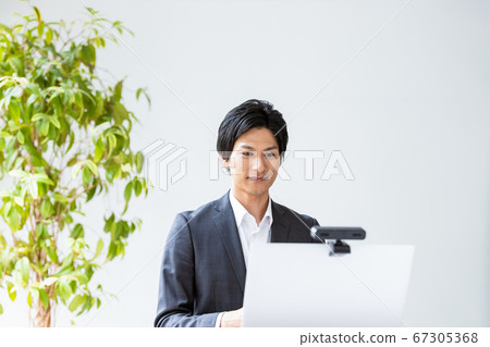 Young business man having a video call 67305368