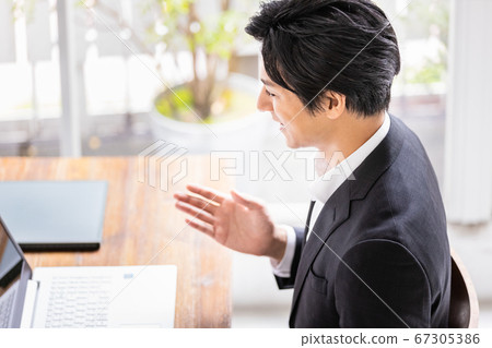 Young business man having a video call 67305386