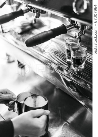 making espresso coffee close up detail with modern 67307964