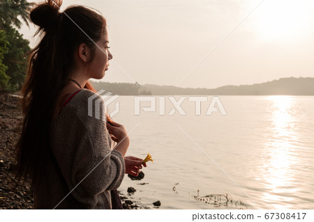 Rear View Of Asian Girl Standing At Beach During 67308417
