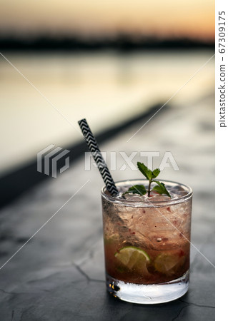 strawberry caipirinha mixed cocktail drink in 67309175