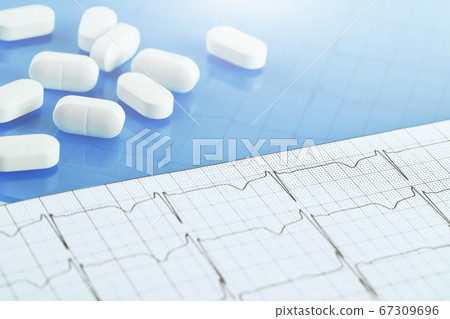 Background of white tablets or pills on the table. 67309696