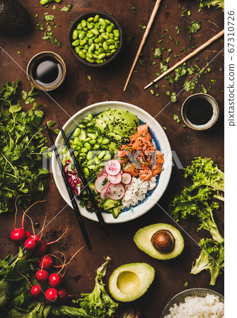 Salmon poke bowl or sushi bowl with vegetables Salmon poke bowl or sushi bowl with vegetables 67310726