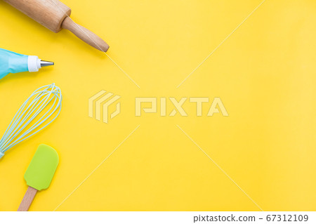 top view baking utensils on yellow background with 67312109