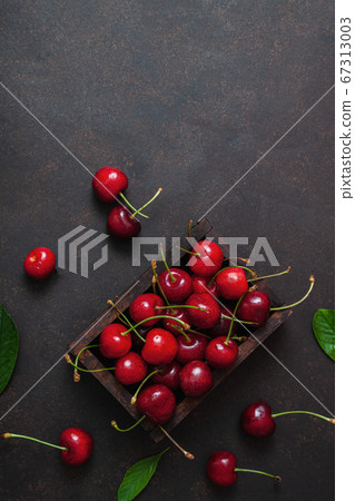 Cherry with leaf on plate and water dropsand on Cherry with leaf on plate and water dropsand on 67313003