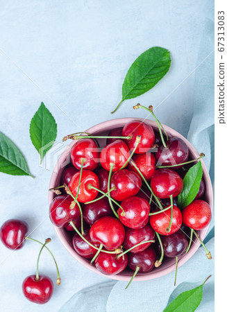 Cherry with leaf on plate and water dropsand on Cherry with leaf on plate and water dropsand on 67313083