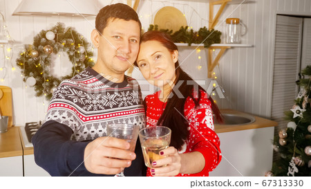 wife and husband with glasses of champagne congratulate wife and husband with glasses of champagne congratulate 67313330